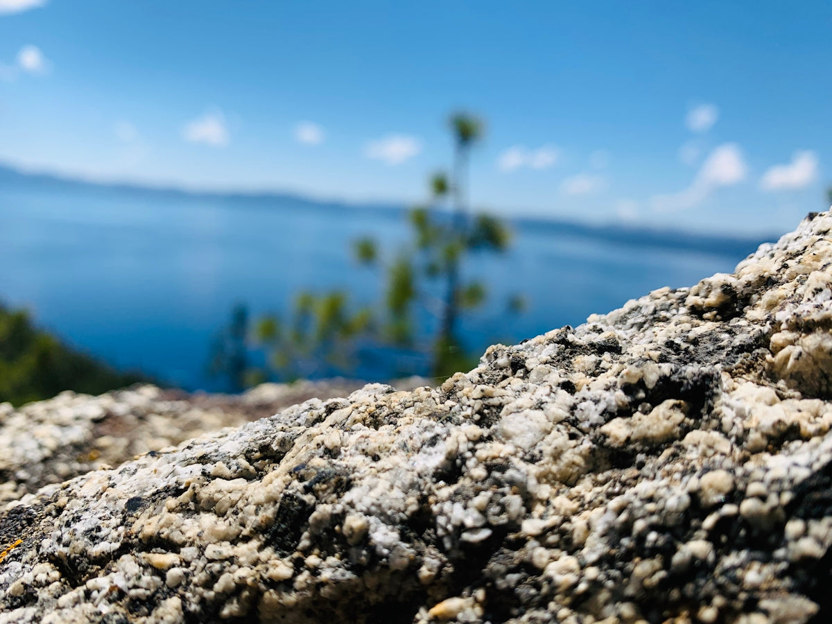 gray rock near body of water during daytime